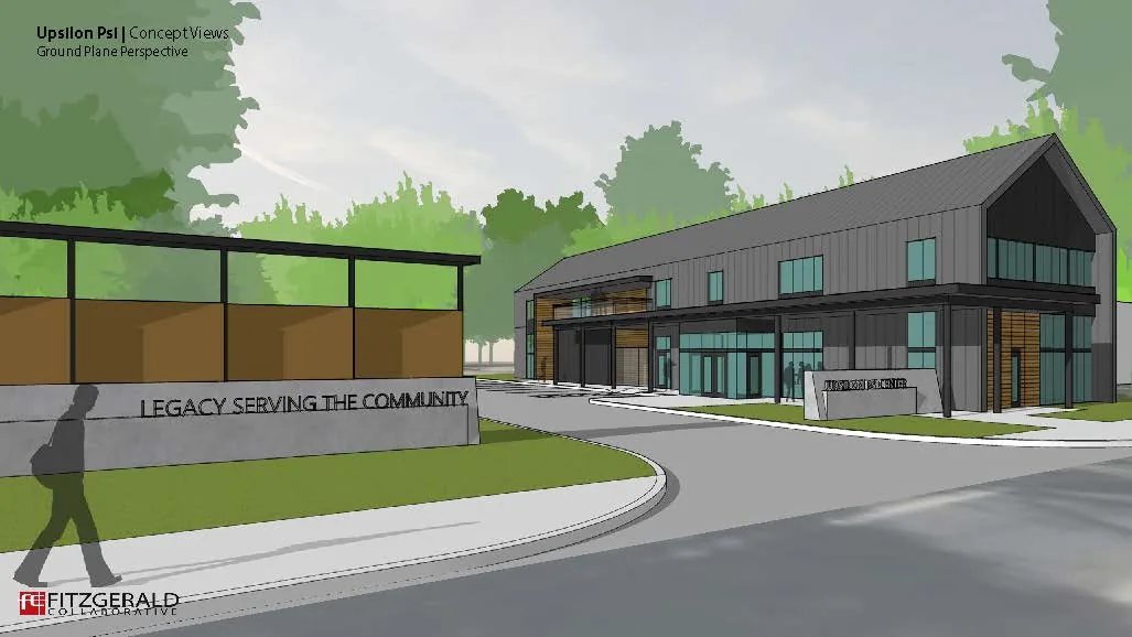 Ground-level rendering from the site entry, with the legacy kiosk and its LEGACY SERVING THE COMMUNITY signage wall in the foreground and the building beyond.